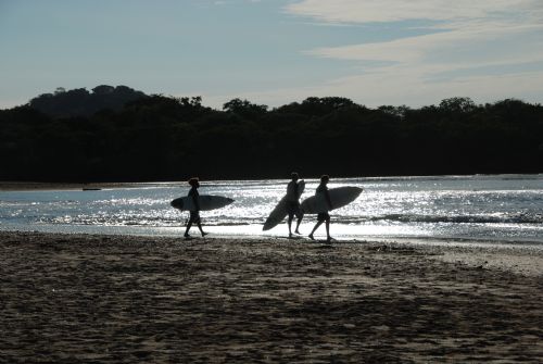 Walking to surf at Playa Langosta